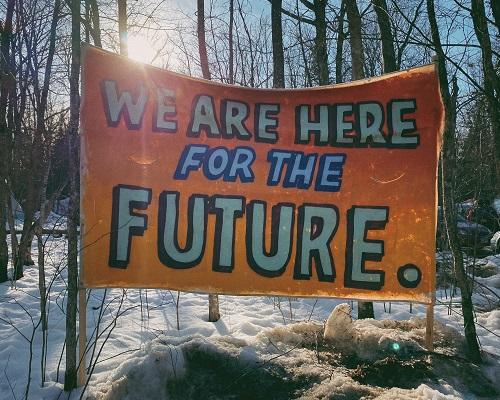 "We Are Here For The Future" Sign